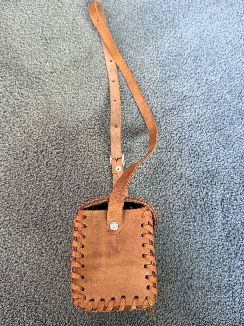Vintage Tooled Leather Crossbody Bag with Buckle Front.